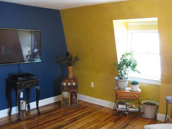 73 Walnut Avenue, Unit 3 Boston, MA 02119 - Photo 10 of 19 a table and a vase sitting on a table
