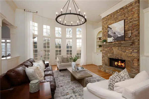 a view of a dining room kitchen island and stainless steel appliances