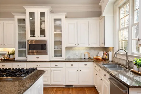 a spacious bedroom with a bed and a couch