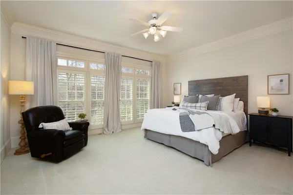 a bathroom with a granite countertop sink a toilet and a mirror