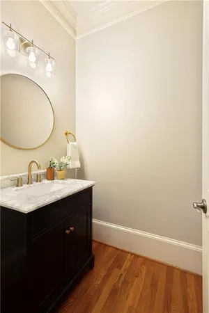 a living room with furniture ceiling fan and a flat screen tv