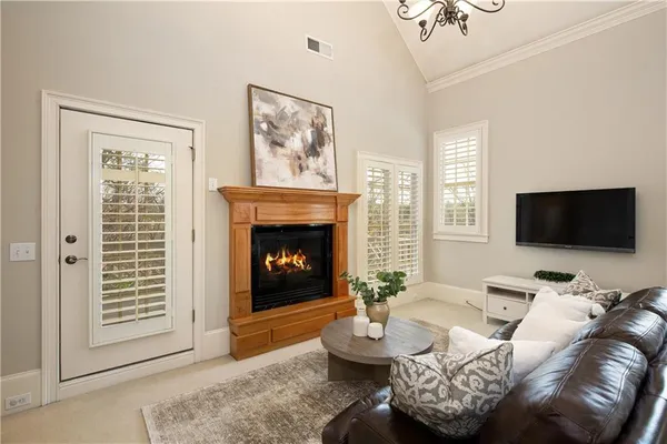 a view of a lake with table and chairs