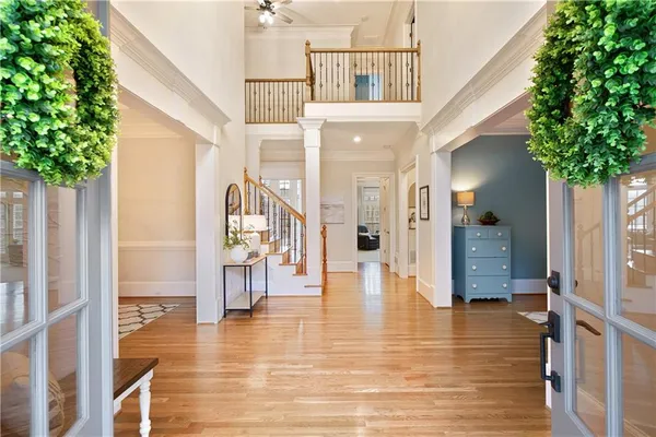 a view of a dining room and hall with furniture