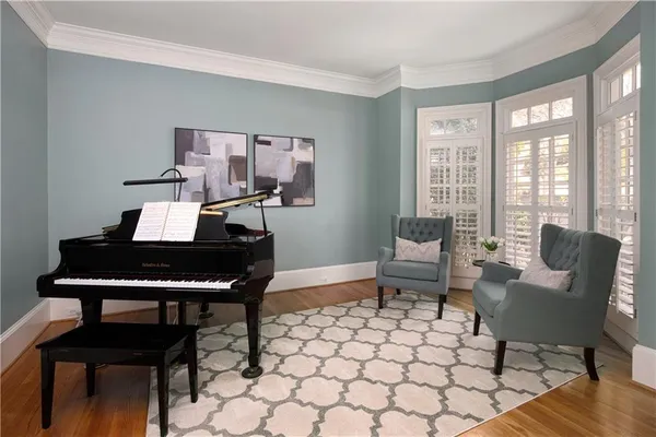 a kitchen with stainless steel appliances a stove a sink a counter space and a window
