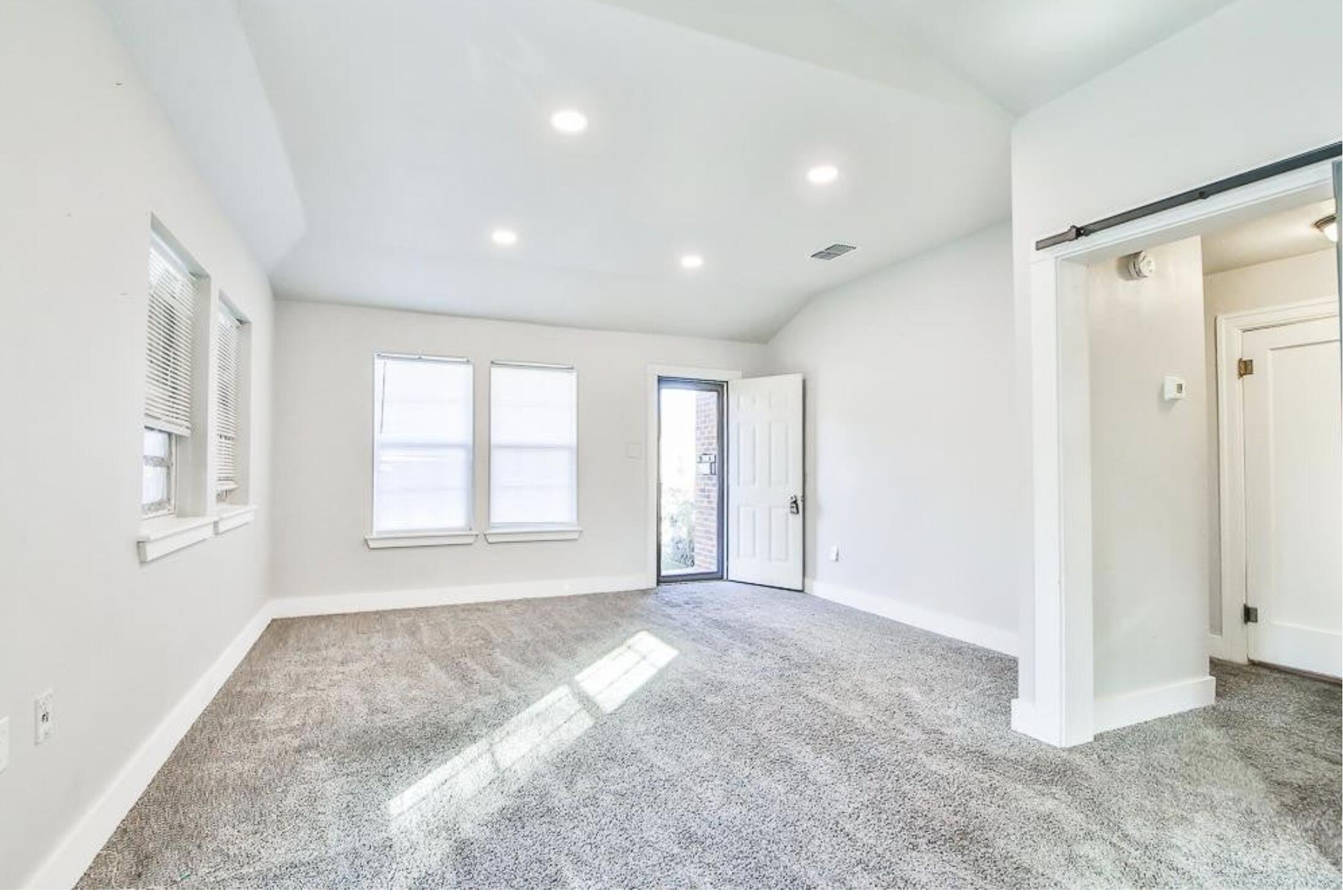 1913 27th Street Lubbock, TX 79411 - Photo 3 of 12 a view of an empty room with a window