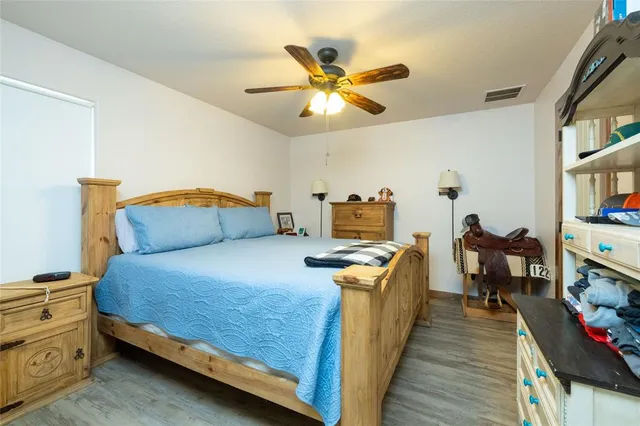 a bed room with a bed and a chandelier