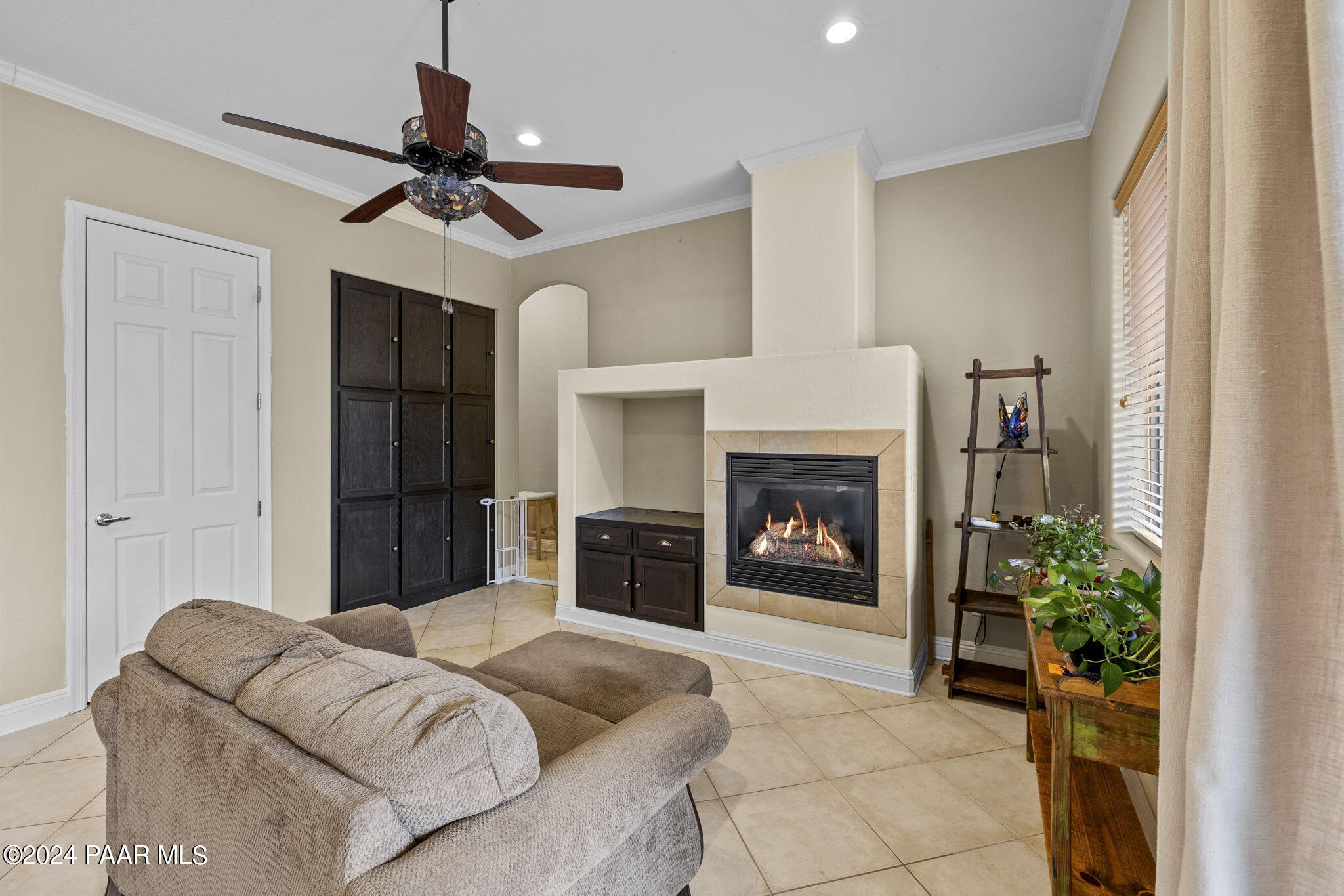 4793 Edgemont Road Prescott Valley, AZ 86314 - Photo 8 of 33 a living room with furniture and a fireplace