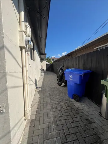a view of a backyard with sitting area