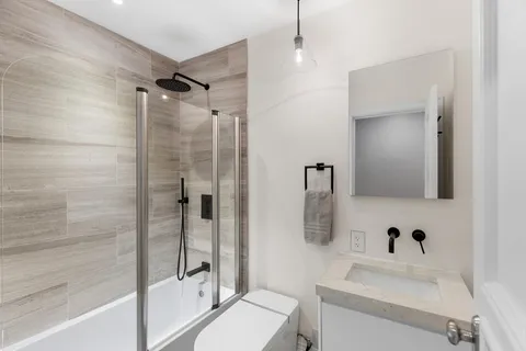 a view of a hallway with a white walls