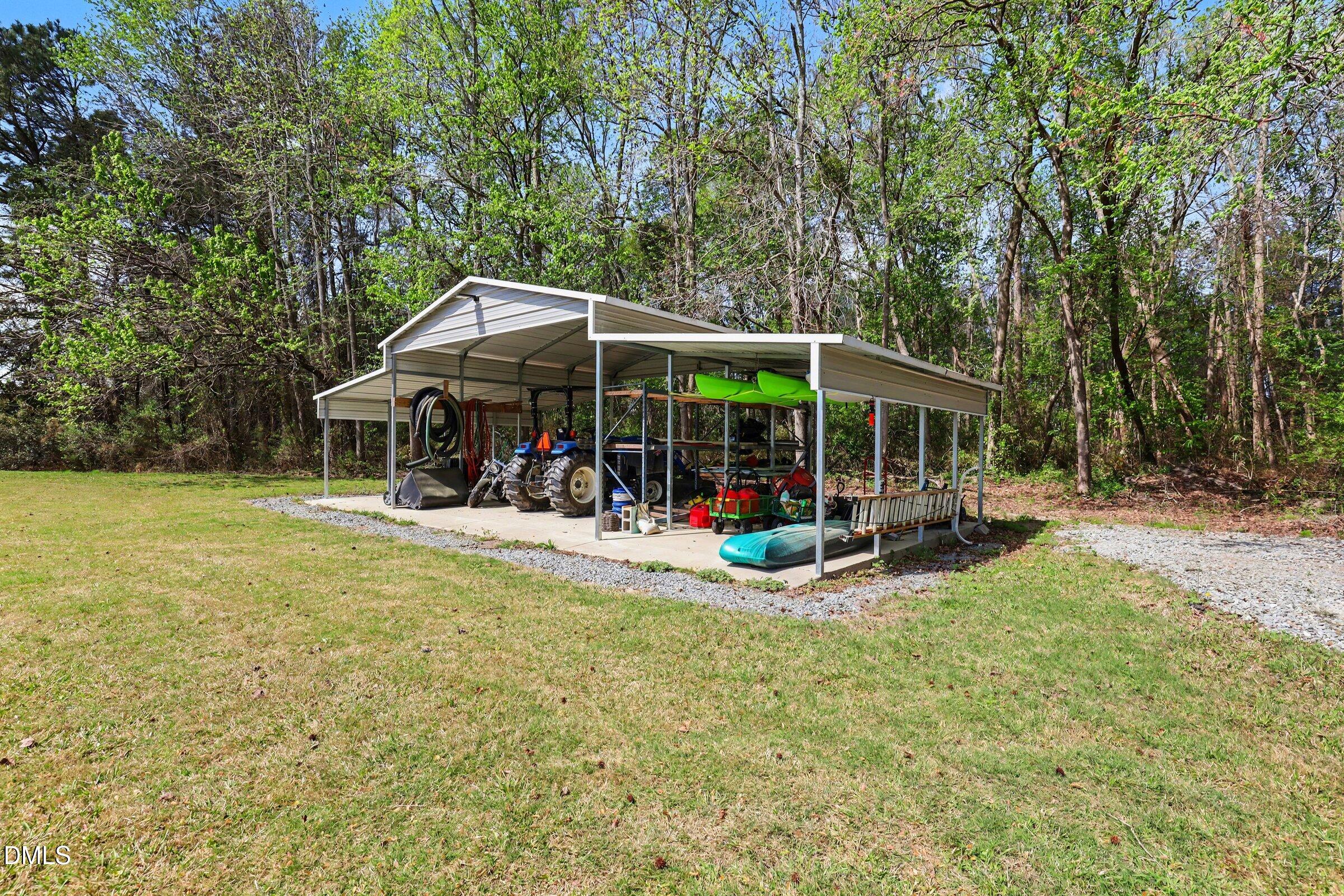 430 Fred Hall Road Stedman, NC 28391 - Photo 60 of 63 a view of a house with a yard patio and a patio