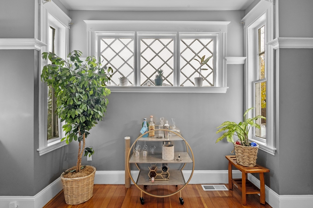 9 Pickman Road Salem, MA 01970 - Photo 18 of 31 a dining room with furniture and a potted plant