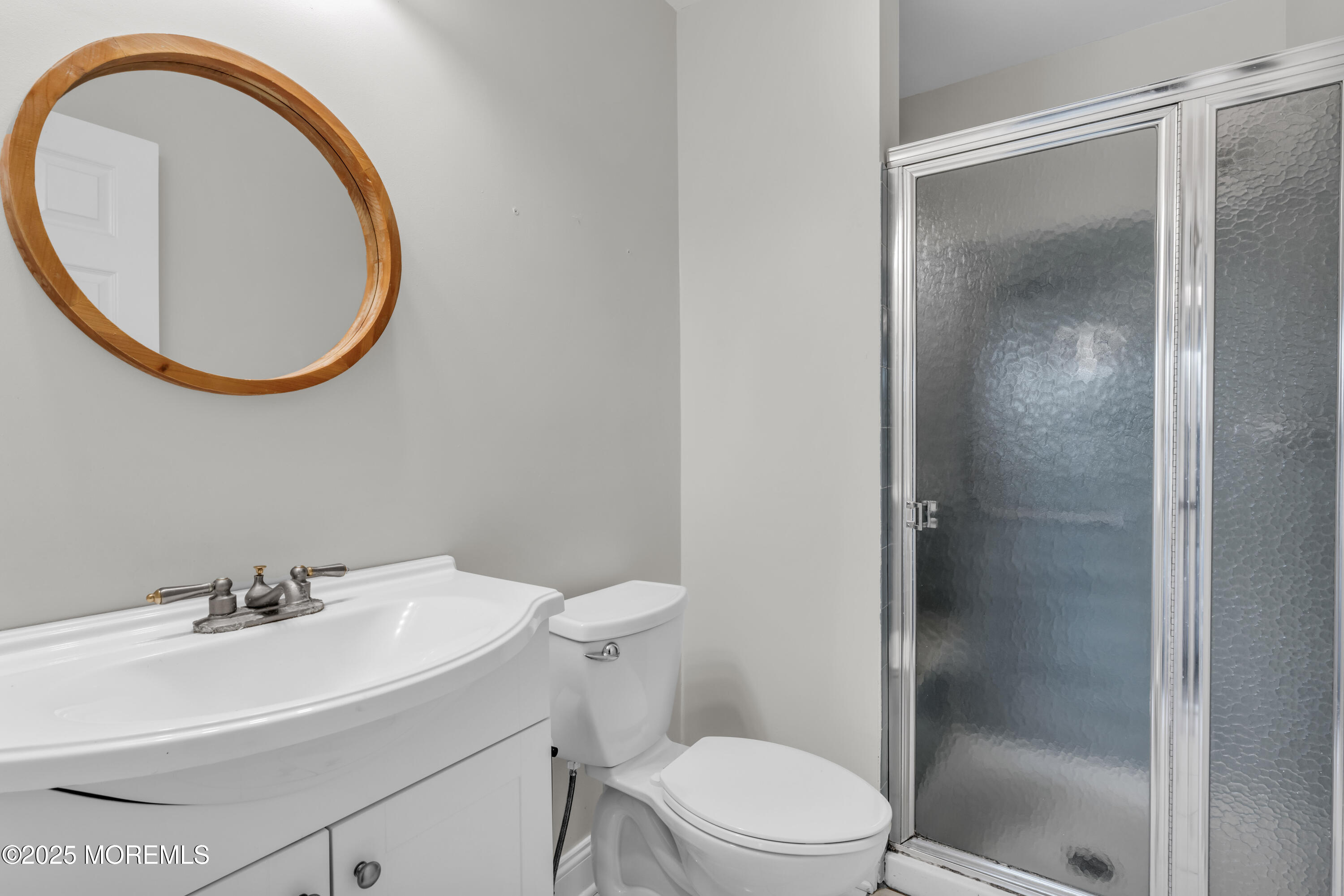 33 Auburn Court Red Bank, NJ 07701 - Photo 16 of 23 a bathroom with a sink a mirror a toilet and a mirror