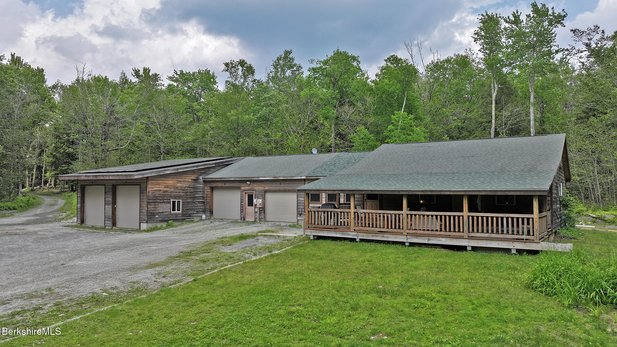 a view of a house with a backyard and a garden