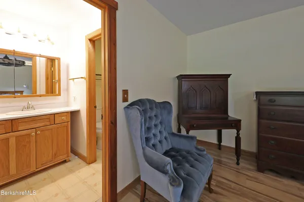 a spacious bathroom with a bathtub and a sink