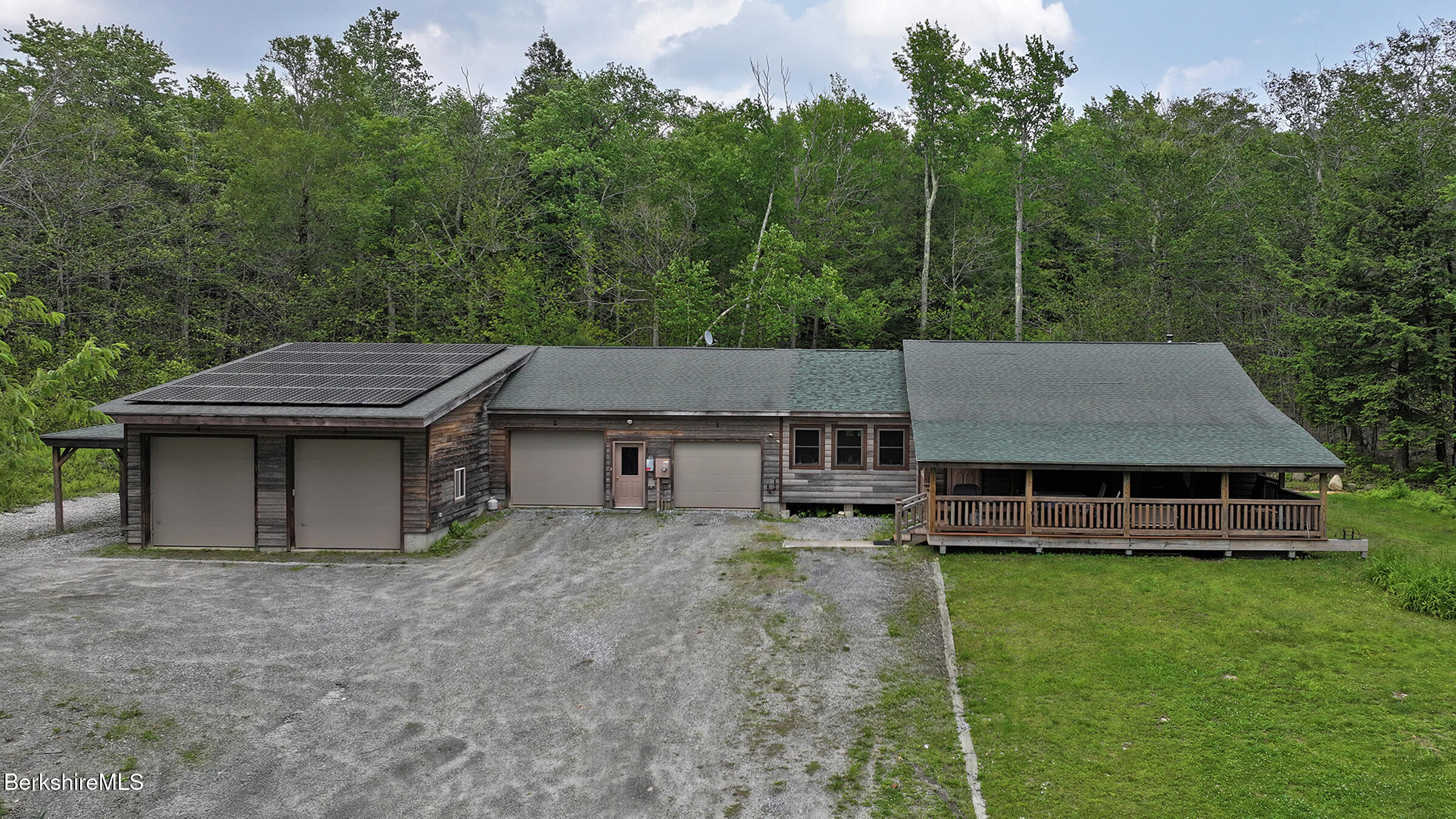 289 Algerie Road Becket, MA 01223 - Photo 2 of 33 a view of a house with a yard and sitting area