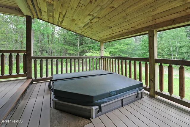 a balcony with wooden floor