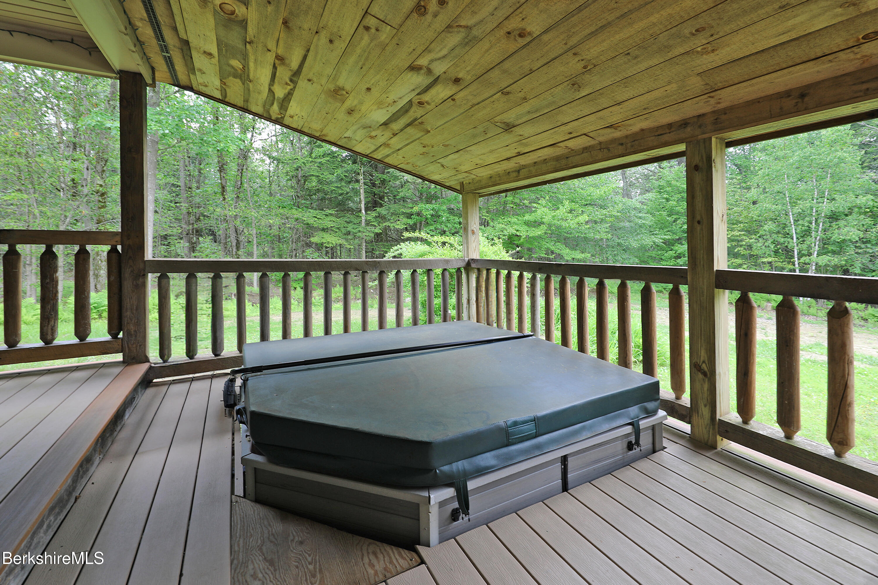 289 Algerie Road Becket, MA 01223 - Photo 26 of 33 a balcony with wooden floor