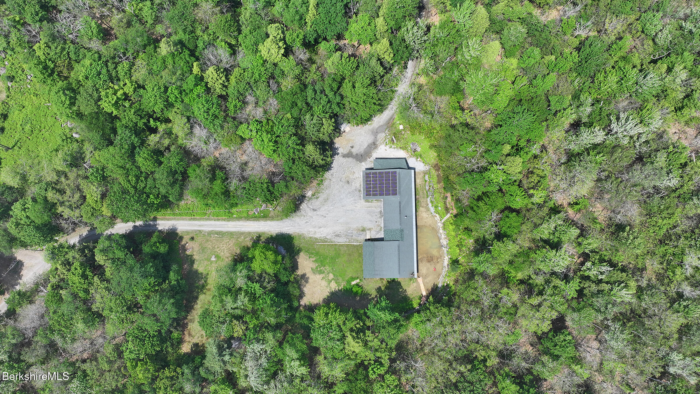289 Algerie Road Becket, MA 01223 - Photo 29 of 33 a view of a garden with a brick wall