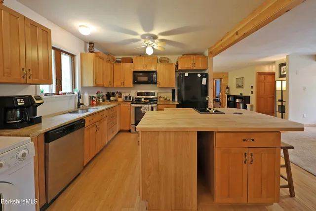 a kitchen with counter top space appliances and cabinets