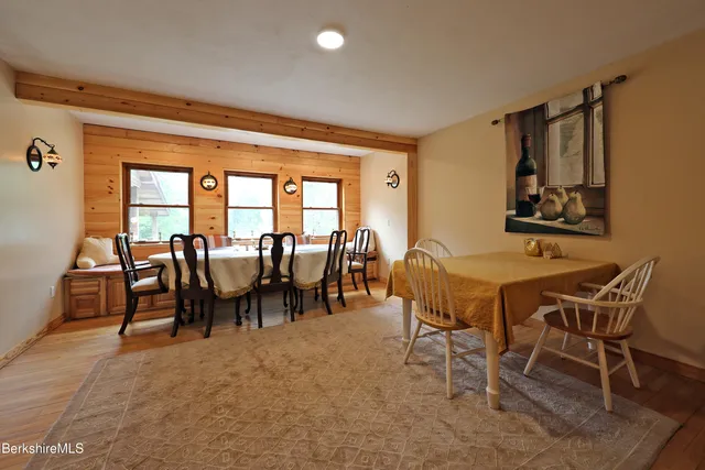 a view of a dining room with furniture and a table