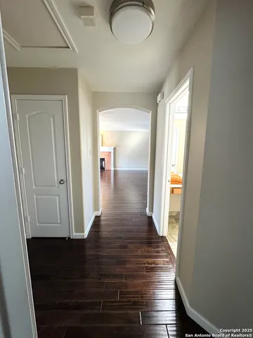 a view of gallery with wooden floor