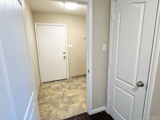 a view of a room with racks on the wall