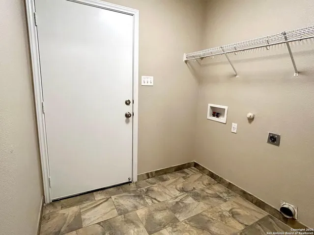 a view of a deck with two couches chair and wooden fence