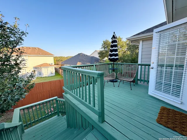 a view of balcony with wooden floor