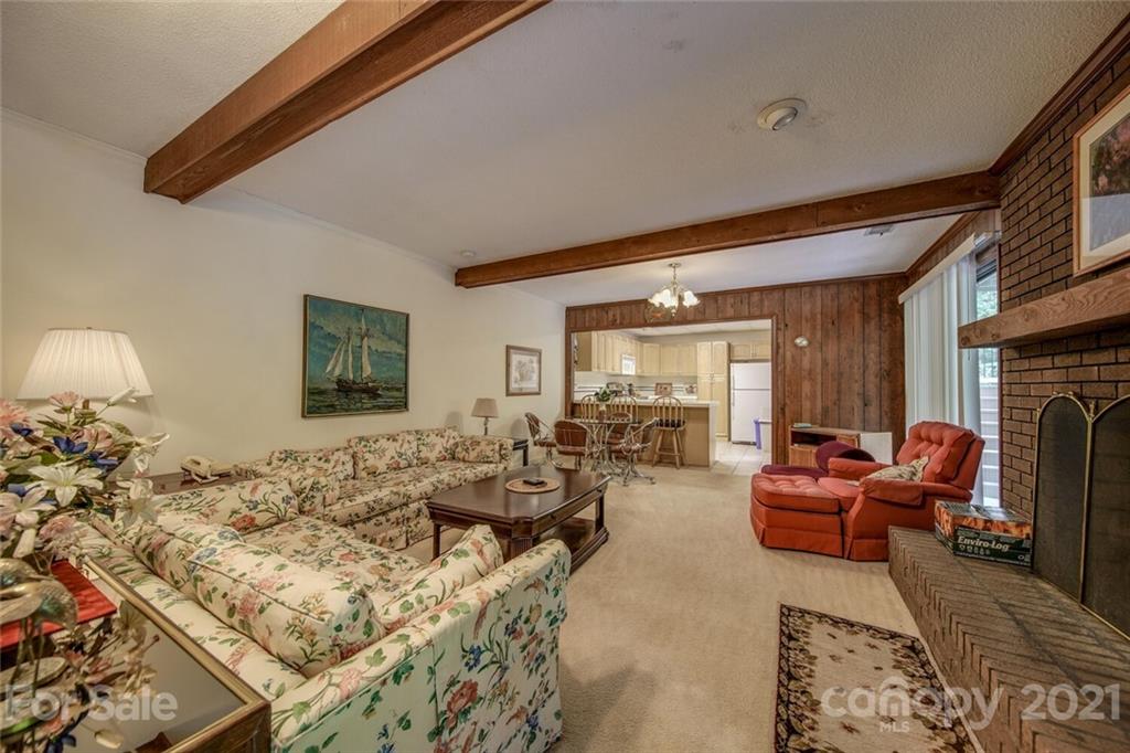 12 Catawba Ridge Road Lake Wylie, SC 29710 - Photo 22 of 37 a living room with furniture large window and a fireplace