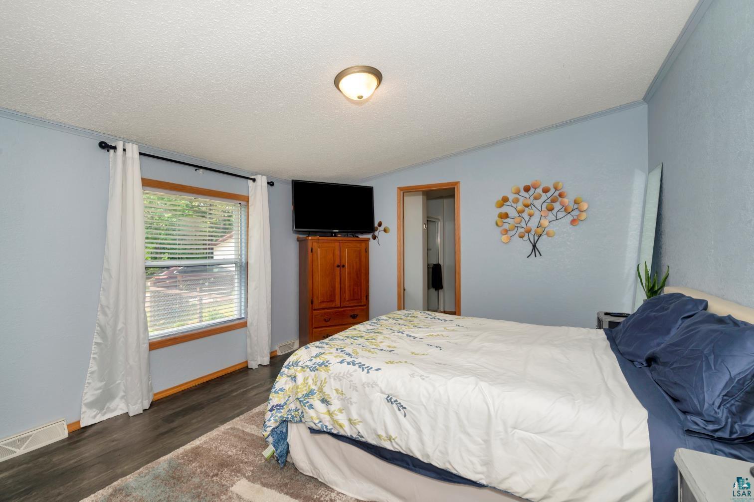 8835 County Rd A Solon Springs, WI 54873 - Photo 8 of 18 Bedroom featuring dark hardwood / wood-style flooring