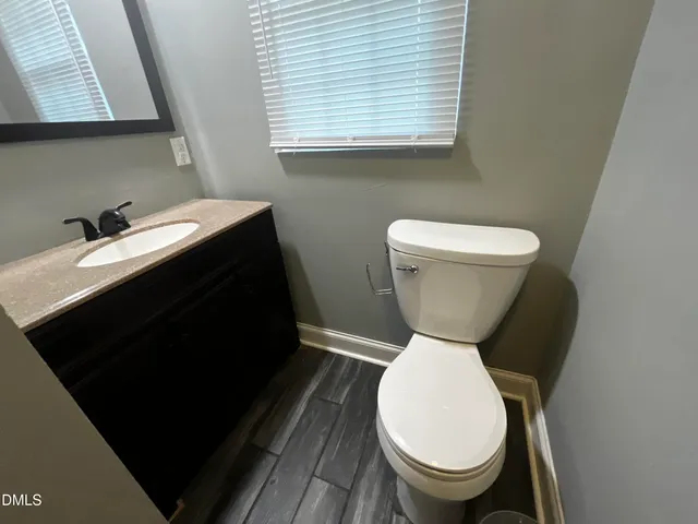 a bathroom with a toilet and a sink
