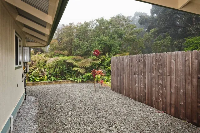 a view of a backyard with pathway