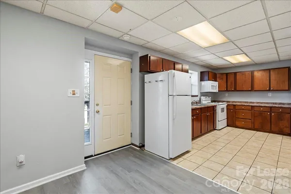 a kitchen with stainless steel appliances a refrigerator and a stove top oven