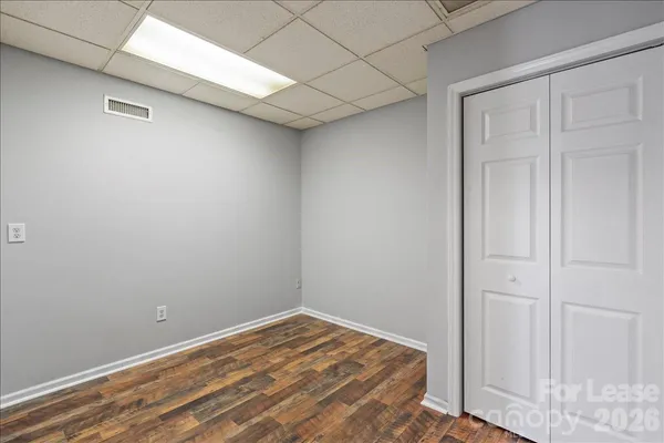 a view of a room that has a bed in it