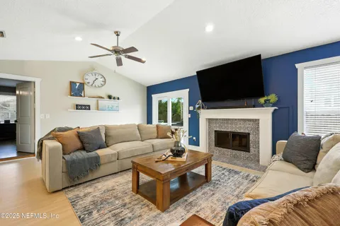 a living room with furniture and a flat screen tv
