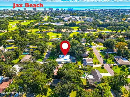 a view of an entryway with wooden floor and door