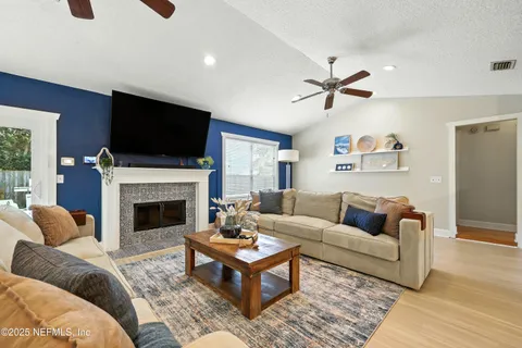 a living room with furniture and a flat screen tv