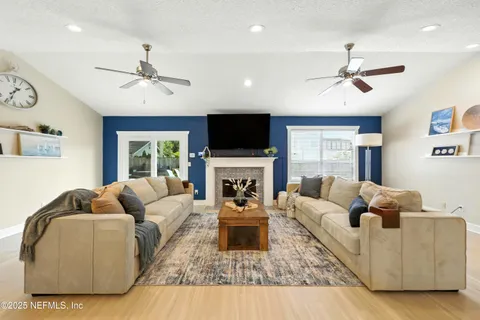 a living room with furniture and a fireplace