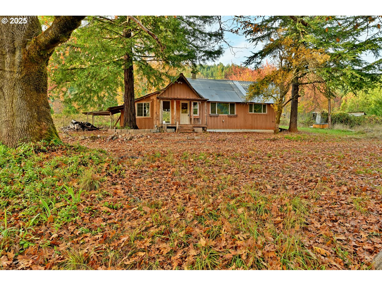 1480 Bridge Lane Wolf Creek, OR 97497 - Photo 13 of 28 a front view of a house with a yard