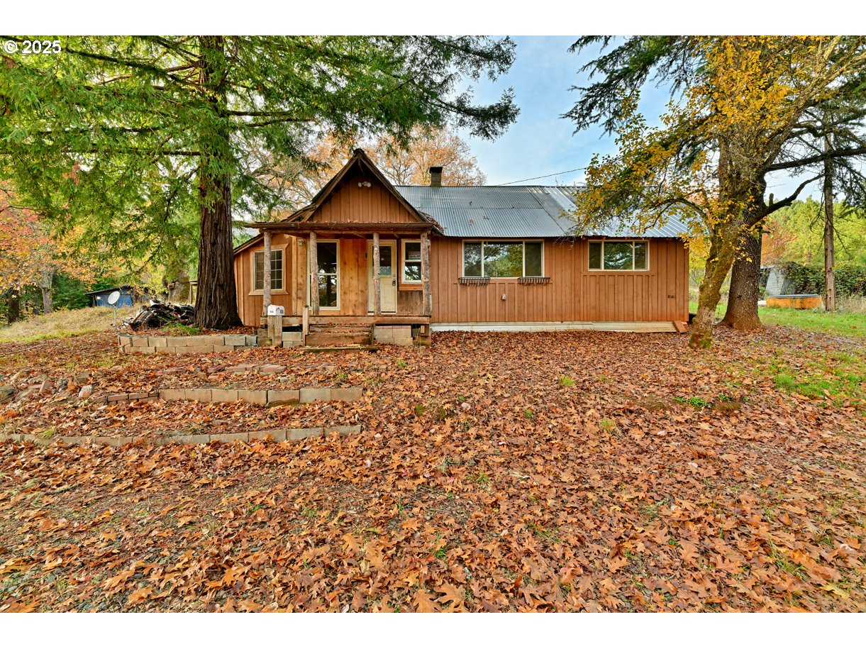 1480 Bridge Lane Wolf Creek, OR 97497 - Photo 16 of 28 a front view of a house with a yard