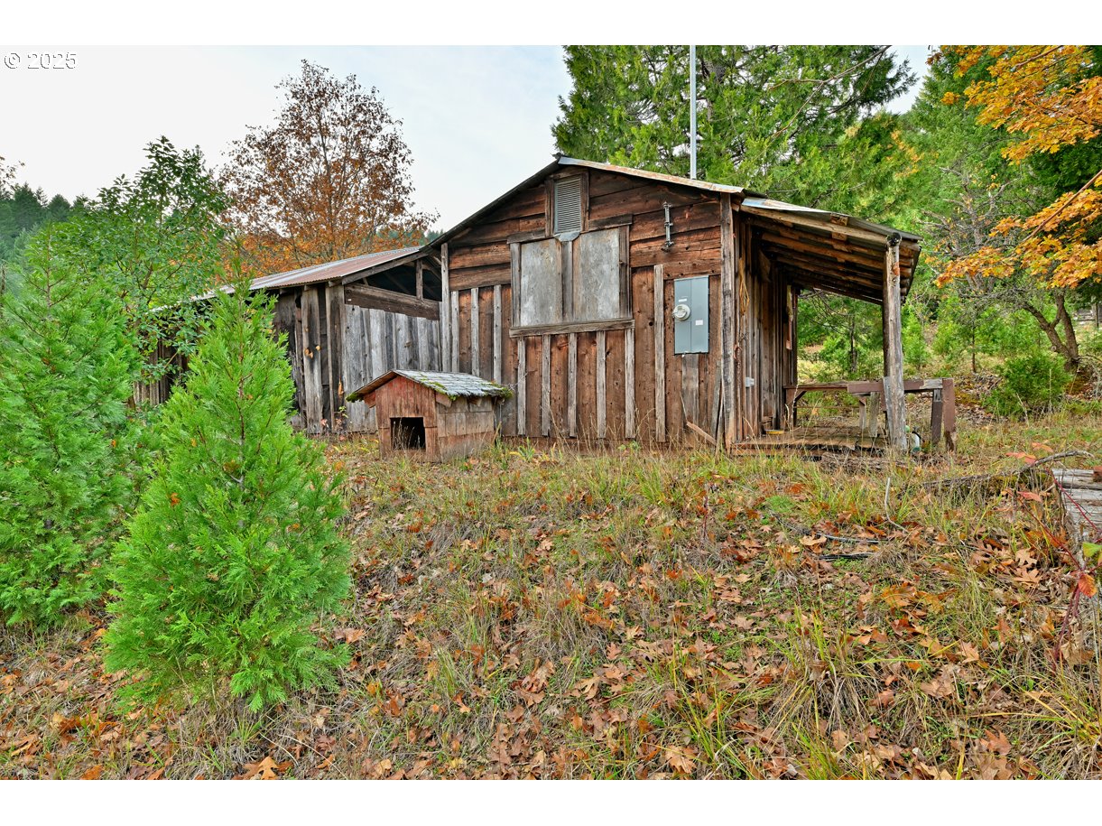 1480 Bridge Lane Wolf Creek, OR 97497 - Photo 18 of 28 a front view of a house with garden