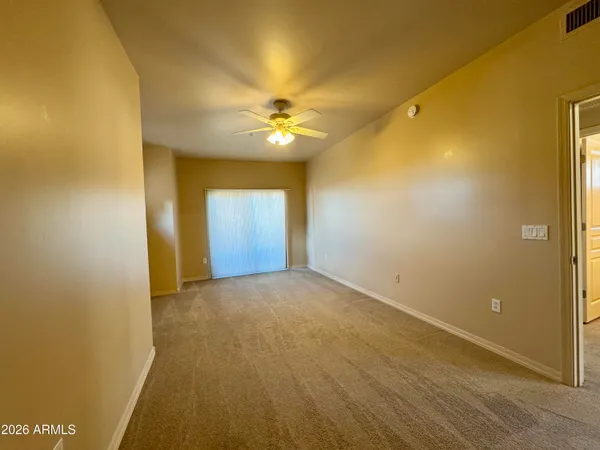 a view of an empty room with a window