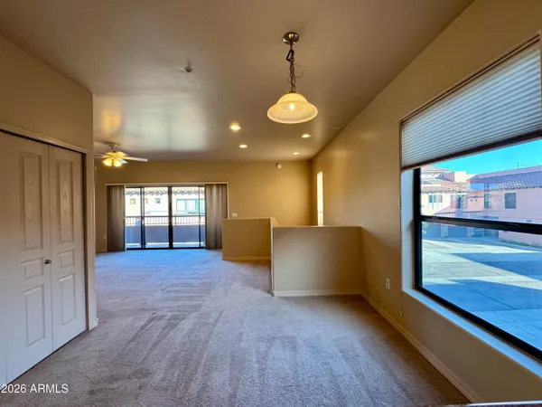 a view of an empty room and window