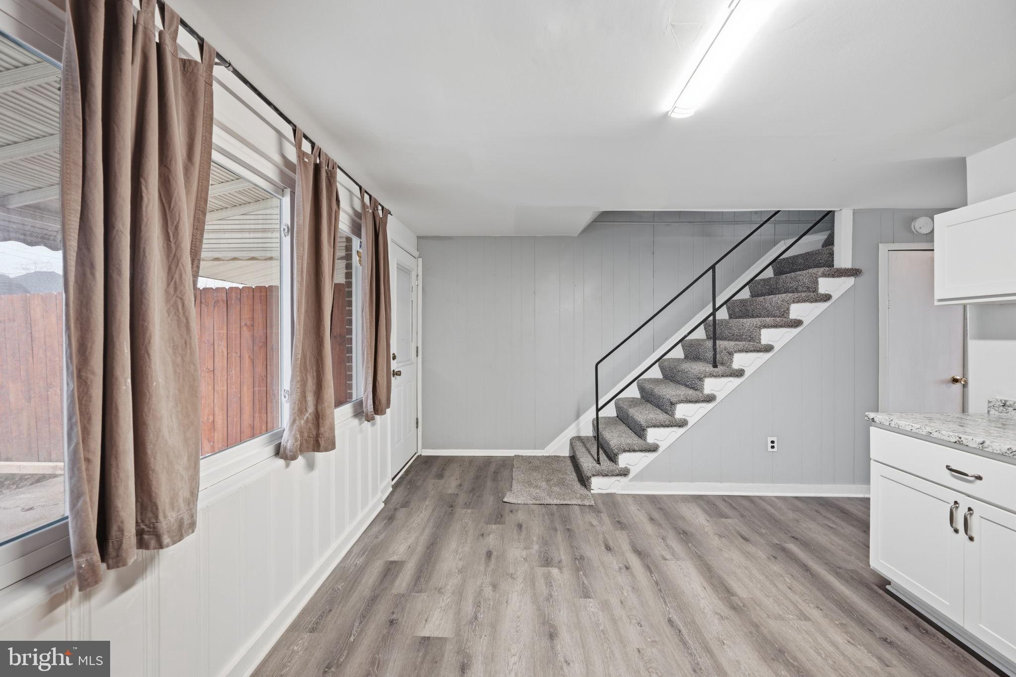 7911 Bank Street Baltimore, MD 21224 - Photo 14 of 40 a view of entryway and hall with wooden floor