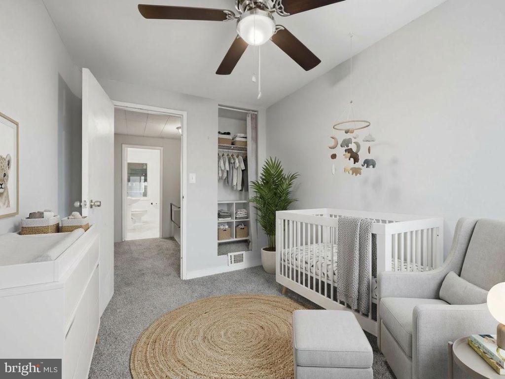 7911 Bank Street Baltimore, MD 21224 - Photo 17 of 40 a living room with furniture and a chandelier