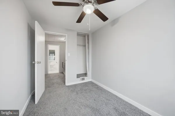 a view of entryway and chandelier fan