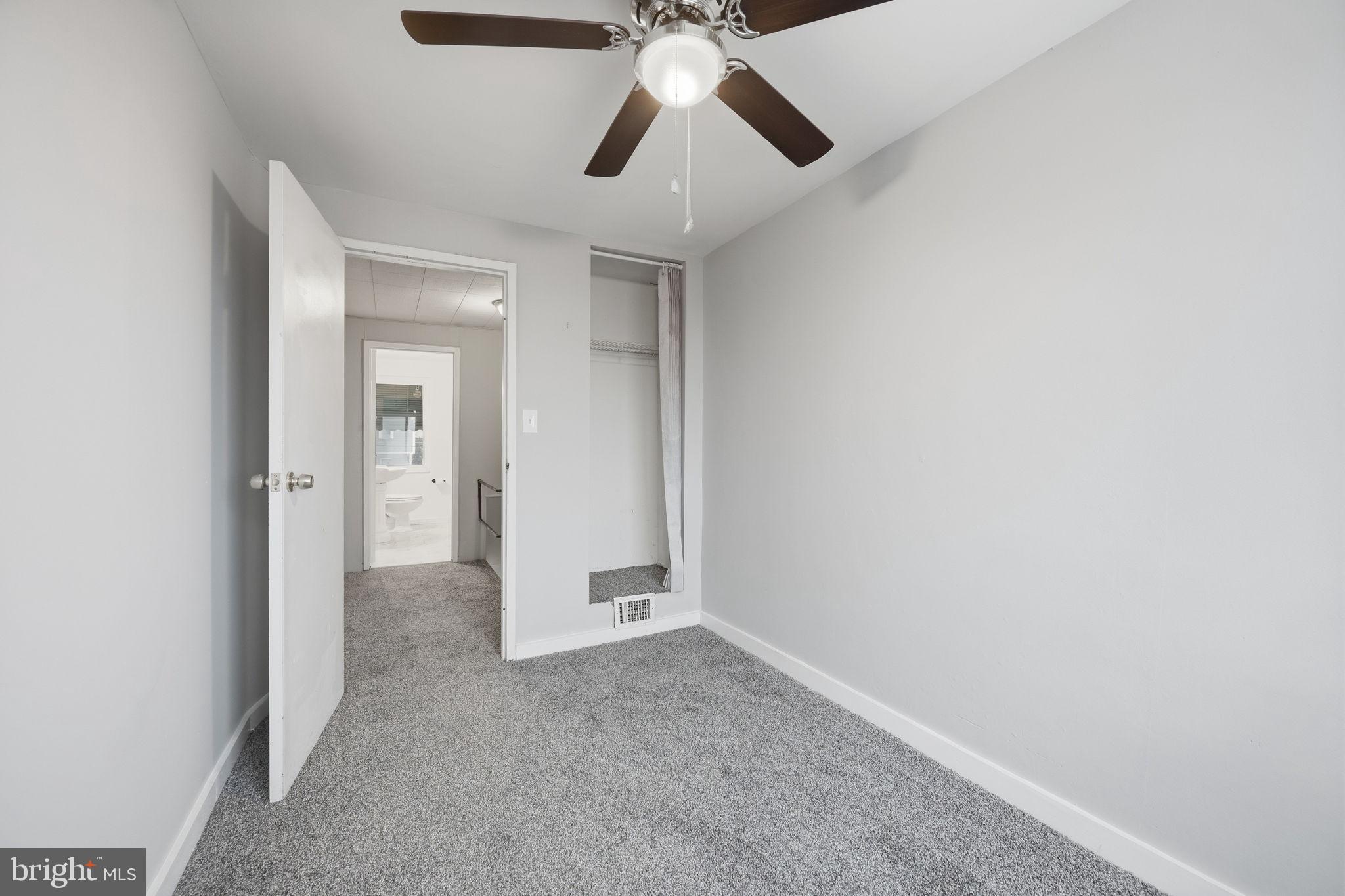 7911 Bank Street Baltimore, MD 21224 - Photo 18 of 40 a view of entryway and chandelier fan