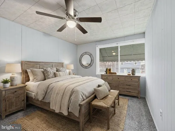 a bed room with a bed and a window