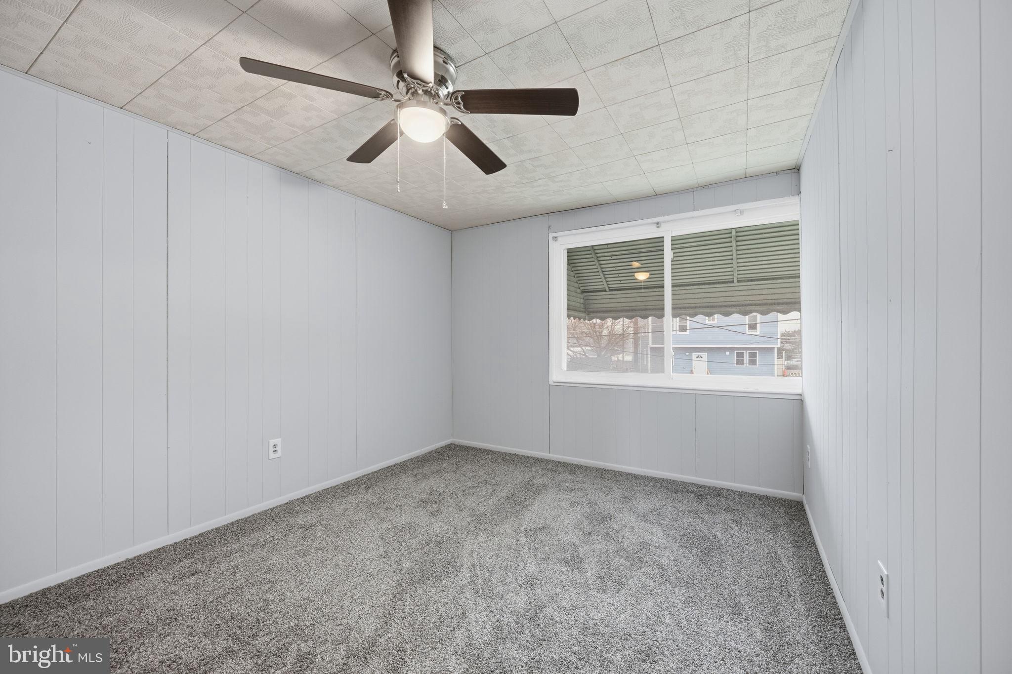 7911 Bank Street Baltimore, MD 21224 - Photo 21 of 40 a view of an empty room with a window