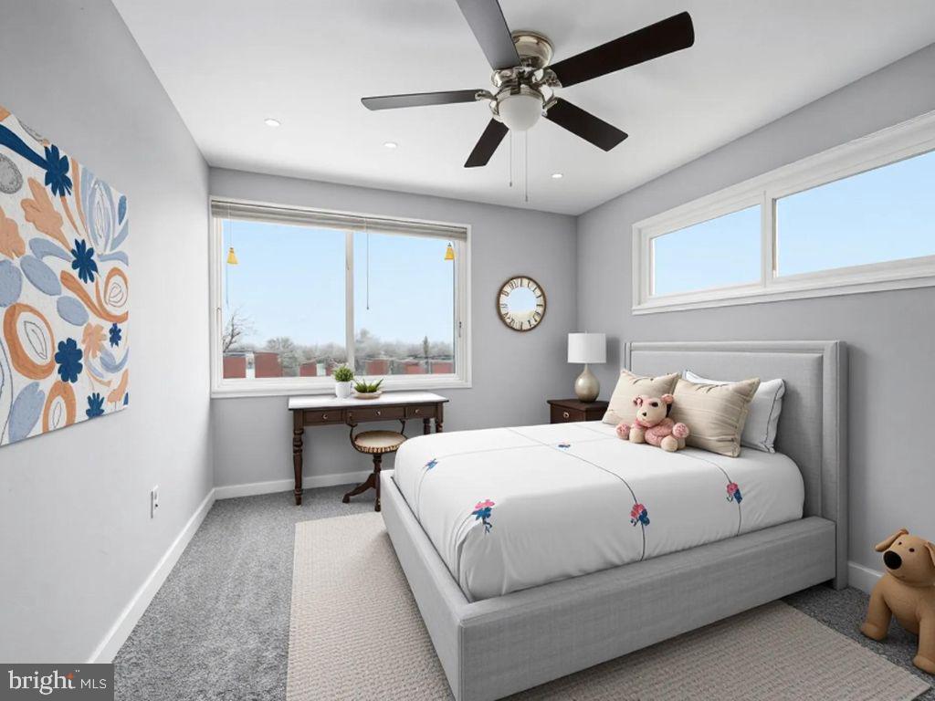 7911 Bank Street Baltimore, MD 21224 - Photo 26 of 40 a bedroom with a large bed and a chandelier